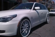 2009 BMW 535xi wagon white with tan leather & color matched 22" wheels.